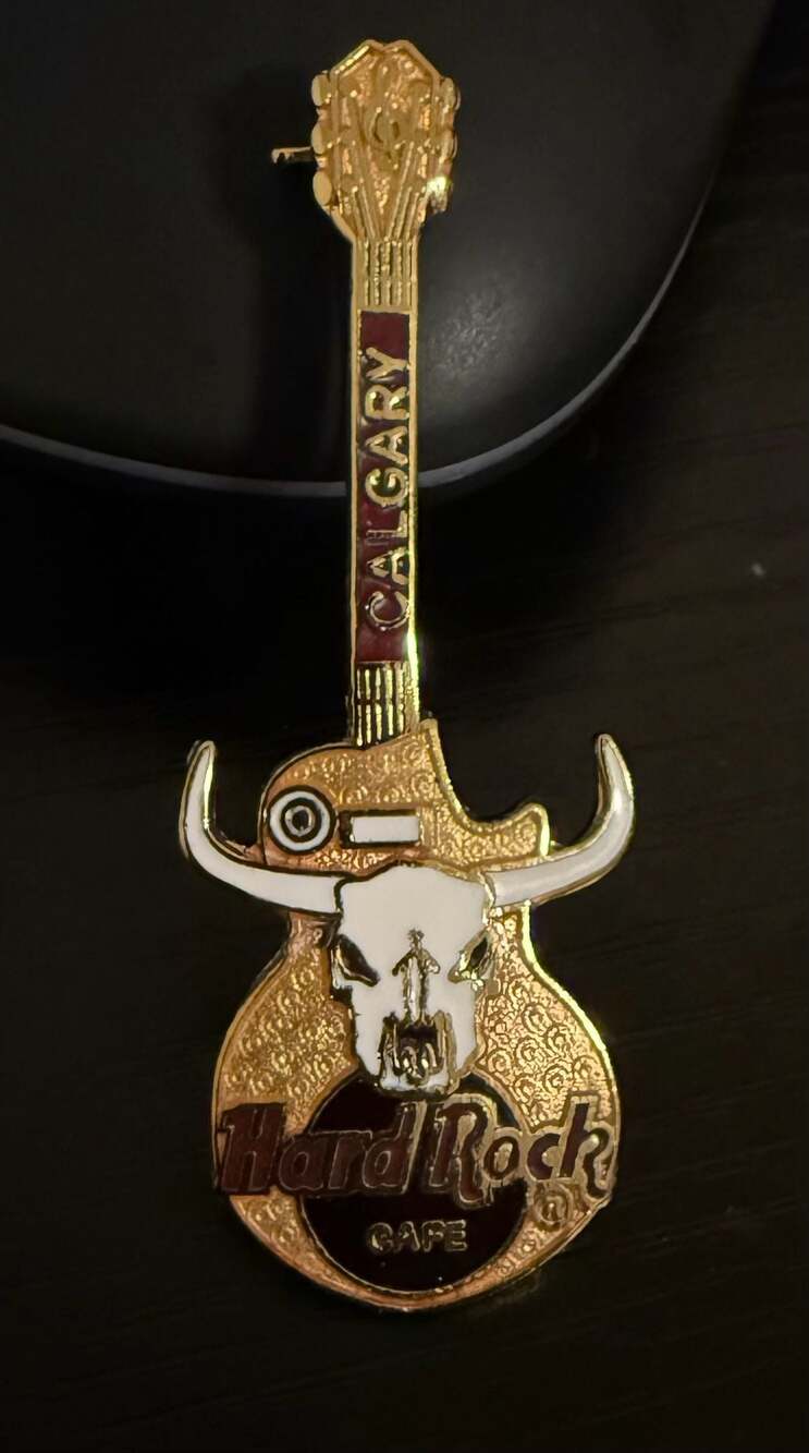 Hard Rock Cafe Calgary Guitar Pin with Bull Skull Logo Gold Tone